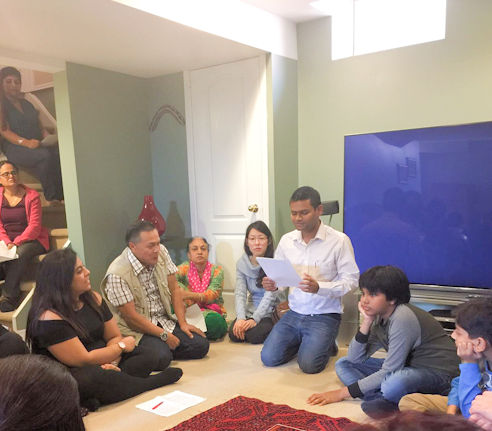 Amit speaking at a district meeting